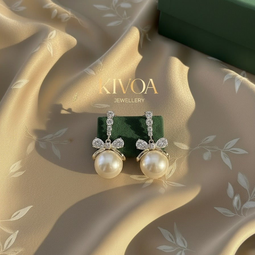Elegant Crystal Bow & Large Pearl Drop Earrings