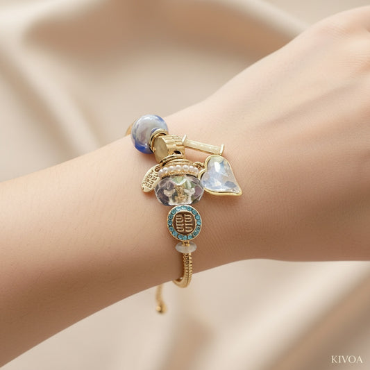 KIVOA Gold Plated Charm Bracelet with Blue & Clear Crystal Beads