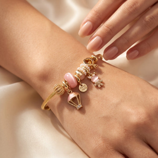 Whimsical Gold Charm Bangle with Pink Balloon & Pearl Accents