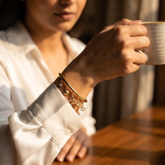 Dainty Gold Travel Charm Bangle: Airplane, Shell & Crystal
