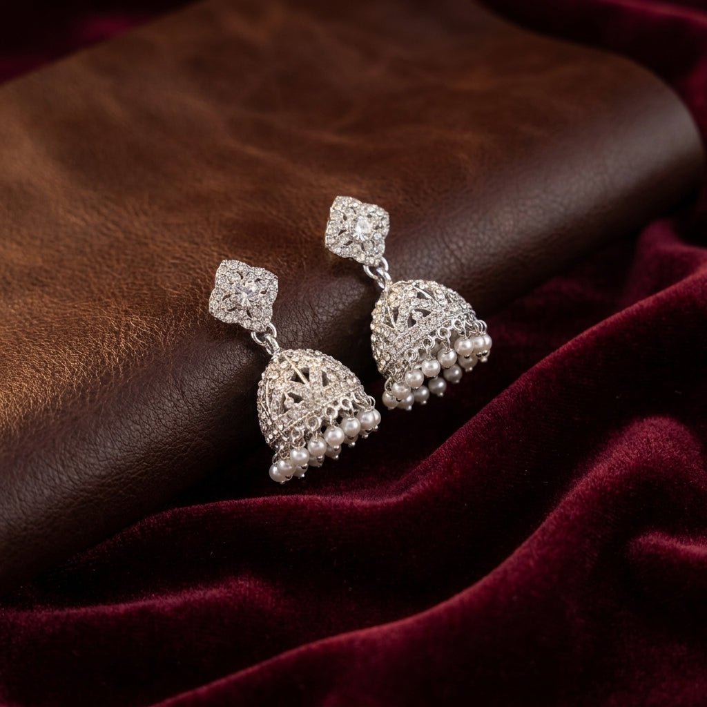 Sparkling Silver-Toned CZ Stone Jhumka Earrings with Pearl Drops